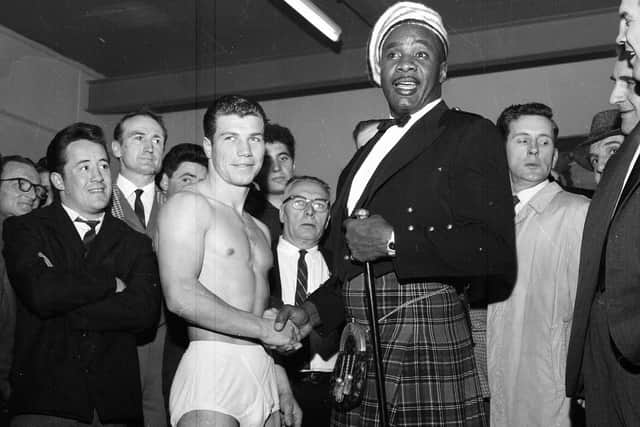 World heavyweight champion Sonny Liston, in full highland dress, wishes Andy Wyper luck  before his first professional fight at Paisley Ice Rink in 1963