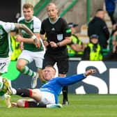 Rangers' John Lundstram was shown a straight red card for this tackle on Hibs' Martin Boyle by referee Willie Collum.