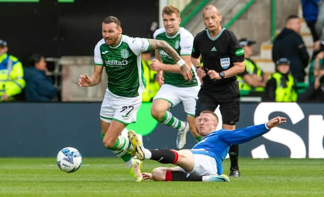 Rangers' John Lundstram was shown a straight red card for this tackle on Hibs' Martin Boyle by referee Willie Collum.