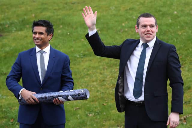 Scottish Conservative leader Douglas Ross with candidate Dr Sandesh Gulhane outside New Stobhill Hospital in Springburn, north Glasgow. Picture: Andrew Milligan/PA
