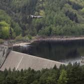 A Lancaster bomber flies over Ladybower reservoir in Derbyshire to mark a previous anniversary of the Second World War Dambusters mission (Picture: Christopher Furlong/Getty Images)