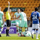Referee Craig Napier shows Hibs' James Jeggo a red card during the match against St Johnstone.