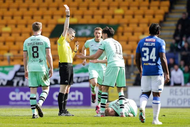 Referee Craig Napier shows Hibs' James Jeggo a red card during the match against St Johnstone.