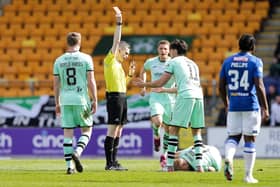 Referee Craig Napier shows Hibs' James Jeggo a red card during the match against St Johnstone.