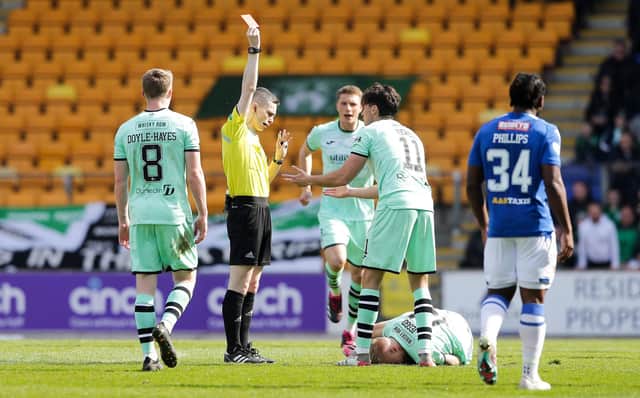 Referee Craig Napier shows Hibs' James Jeggo a red card during the match against St Johnstone.