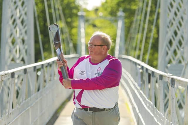 Paul Bush, chairman of Commonwealth Games Scotland, with the Queen's baton ahead of Birmingham 2022. (Photo by Euan Cherry/Getty Images for the Birmingham 2022 Queen's Baton Relay )