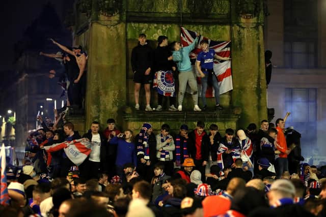 Rangers fans celebrate in George Square after Rangers win the Scottish Premiership title.