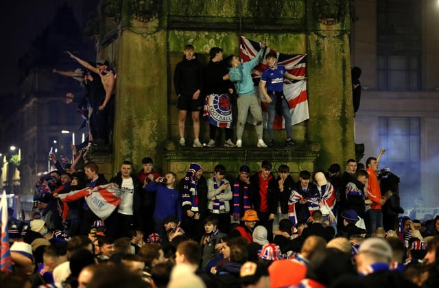 Rangers fans celebrate in George Square after Rangers win the Scottish Premiership title.