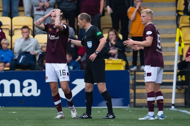 Hearts players protest the winning goal, thinking it was offside. (Photo by Paul Devlin / SNS Group)
