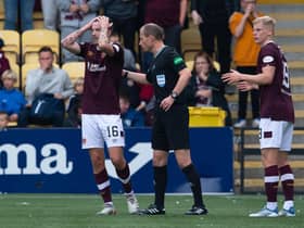 Hearts players protest the winning goal, thinking it was offside. (Photo by Paul Devlin / SNS Group)