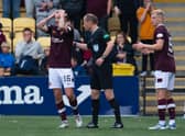 Hearts players protest the winning goal, thinking it was offside. (Photo by Paul Devlin / SNS Group)