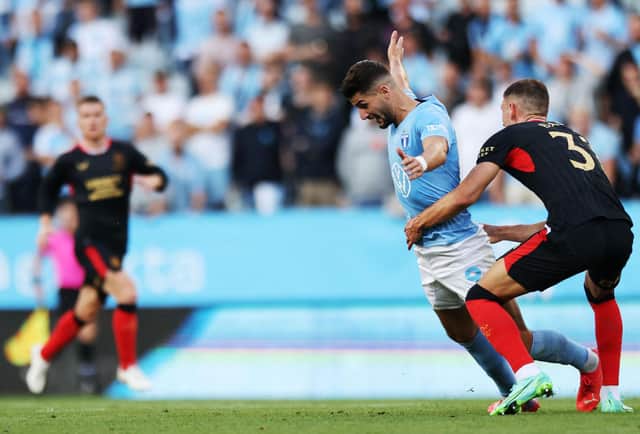 Rangers' Croatian defender Borna Barisic vies with Malmo's Croatian forward Antonio Colak.