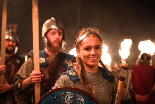 Women and girls were allowed to join the Jarl Squad and lead the torchlight procession for the first time in 2024. Among the participants was Jenna Moar, 16, whose father Richard was the chief jarl during Tuesday night's celebrations. Picture: Andy Buchanana/AFP via Getty Images