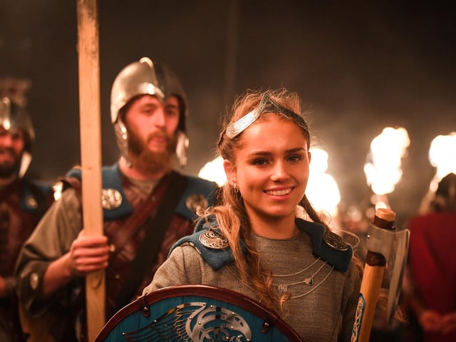 Women and girls were allowed to join the Jarl Squad and lead the torchlight procession for the first time in 2024. Among the participants was Jenna Moar, 16, whose father Richard was the chief jarl during Tuesday night's celebrations. Picture: Andy Buchanana/AFP via Getty Images