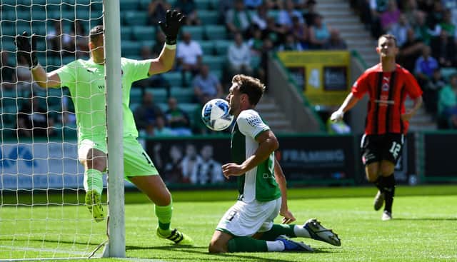 Hibs striker Christian Doidge chests home the first of his three goals in the 5-0 in over Clyde. (Photo by Craig Foy / SNS Group)