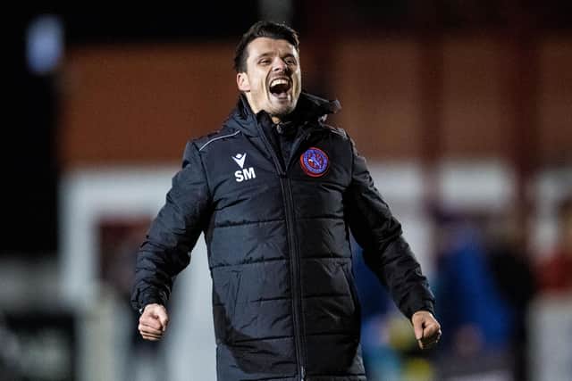 Steven Mackay celebrates Brora's shock 2-1 win over Hearts.