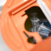 Used syringes  in a sharps bin inside Glasgow's drug consumption room - the first of its kind in the UK (Picture: Andy Buchanan/AFP via Getty Images)