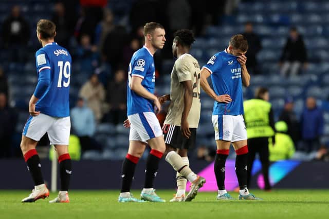 Rangers' players look crestfallen at the full-time whistle.