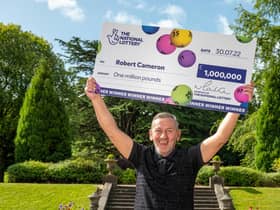 Robert Cameron celebrating as the Glasgow father-of-five is £1 million richer after he followed his late mother's advice and snapped up two lottery tickets
