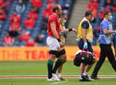 Lions captain Alun Wyn Jones leaves the field with a shoulder injury during the 1888 Cup match between the British & Irish Lions and Japan at BT Murrayfield.