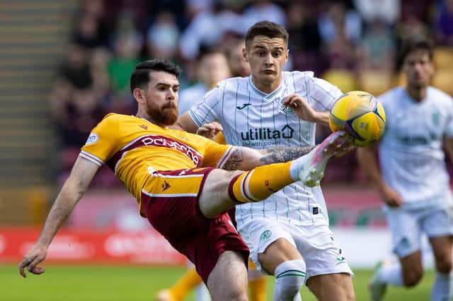 Hibs midfielder Kyle Magennis challenges Liam Donnelly during the 3-2 win over Motherwell.