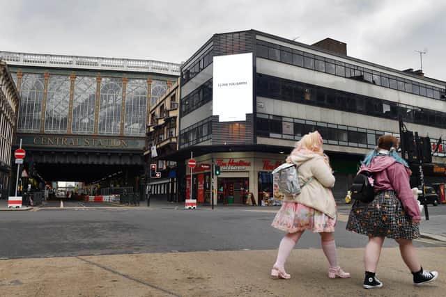 Yoko Ono's artwork I Love You Earth is unveiled to mark Earth Day 2021 on Glasgow Central Station's digital billboard by Serpentine galleries.