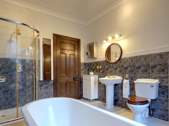 An ensuite with bath and shower
