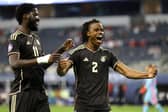 Dexter Lembikisa of Jamaica (right) celebrates with teammate Shamar Nicholson after scoring a wonder goal against Panama. (Photo by Ron Jenkins/Getty Images)