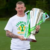 Departing Celtic winger Jonny Hayes is pictured with the Ladbrokes Premiership trophy.
