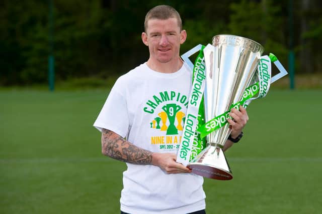 Departing Celtic winger Jonny Hayes is pictured with the Ladbrokes Premiership trophy.