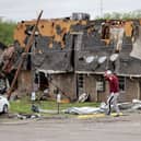 A man walks past tornado damage in Sulphur, Oklahoma, after severe storms hit the area. Picture: PA