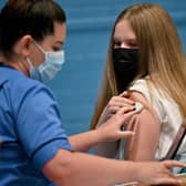 Teenager Eve Thomson receiving a Covid vaccine in Barrhead in August. Photo by Jeff J Mitchell/Getty Images