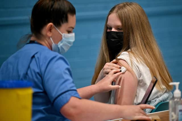 Teenager Eve Thomson receiving a Covid vaccine in Barrhead in August. Photo by Jeff J Mitchell/Getty Images