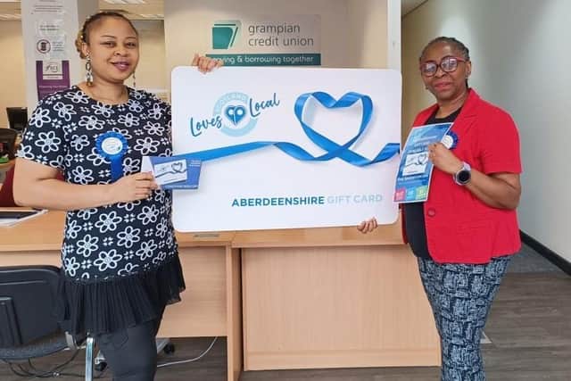 Adeshola Oshunniyi and Chinyere Adeniyi-Alade of Grampian Credit Union which is the first stockist of the Aberdeenshire Loves Local gift card in Aberdeen