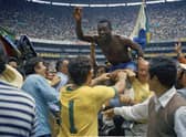 Pele is hoisted on the shoulders of his teammates after Brazil's 4-1 victory in the 1970 World Cup final against Italy (Picture: AP photo, file)