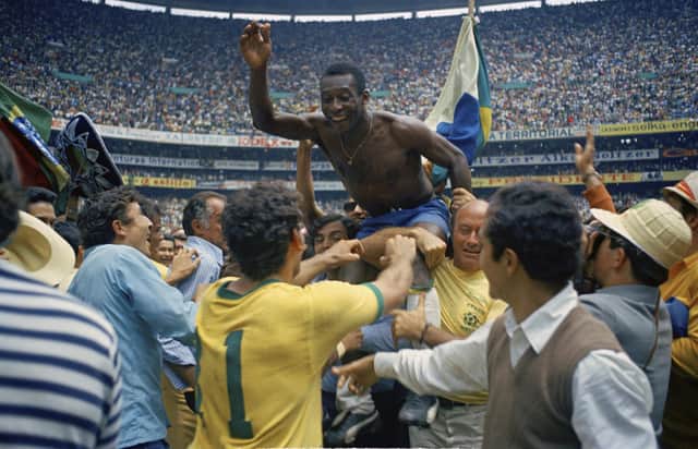Pele is hoisted on the shoulders of his teammates after Brazil's 4-1 victory in the 1970 World Cup final against Italy (Picture: AP photo, file)
