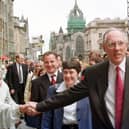 Donald Dewar shakes the hand of a well-wisher on May 12, 1999 - the day of the first meeting of the Scottish Parliament (Picture: Robert Perry)