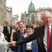 Donald Dewar shakes the hand of a well-wisher on May 12, 1999 - the day of the first meeting of the Scottish Parliament (Picture: Robert Perry)