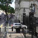 The scene after a car collided with the gates of Downing Street