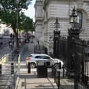 The scene after a car collided with the gates of Downing Street