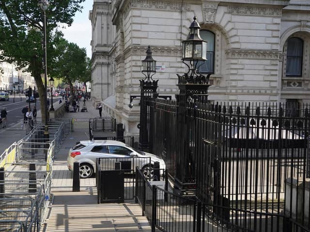 The scene after a car collided with the gates of Downing Street