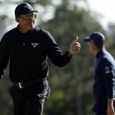 Phil Mickelson shows what it meant to him to birdie the last to close with a 65 in the 87th Masters. Picture: Patrick Smith/Getty Images.