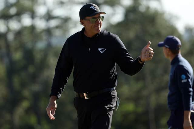 Phil Mickelson shows what it meant to him to birdie the last to close with a 65 in the 87th Masters. Picture: Patrick Smith/Getty Images.