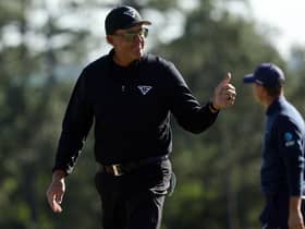 Phil Mickelson shows what it meant to him to birdie the last to close with a 65 in the 87th Masters. Picture: Patrick Smith/Getty Images.