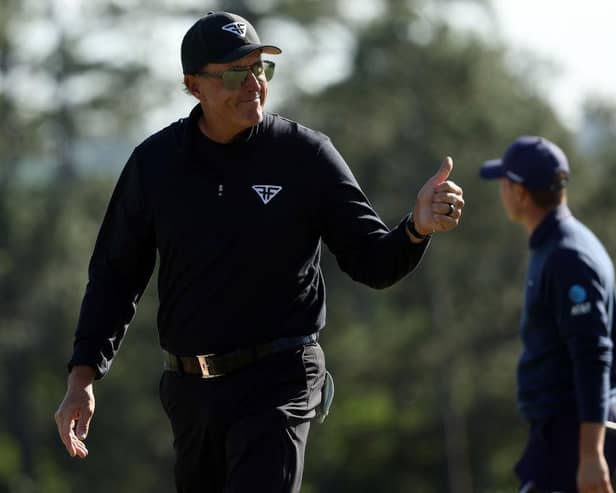 Phil Mickelson shows what it meant to him to birdie the last to close with a 65 in the 87th Masters. Picture: Patrick Smith/Getty Images.