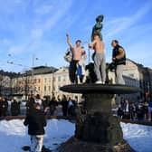 Ice hockey fans celebrate in Helsinki, after Finland's team won the Winter Olympic Games gold medal last year (Picture: Antti Aimo-Koivisto/Lehtikuva/AFP via Getty Images)