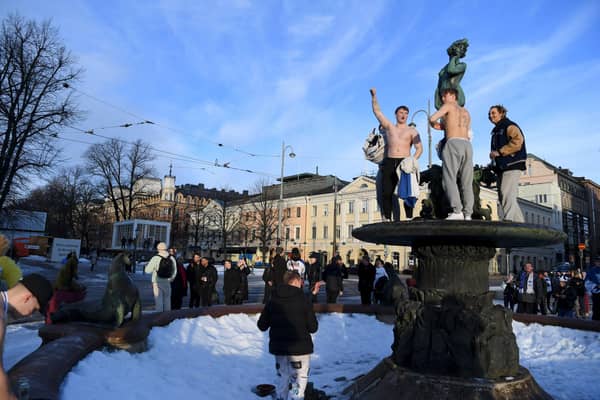 Ice hockey fans celebrate in Helsinki, after Finland's team won the Winter Olympic Games gold medal last year (Picture: Antti Aimo-Koivisto/Lehtikuva/AFP via Getty Images)