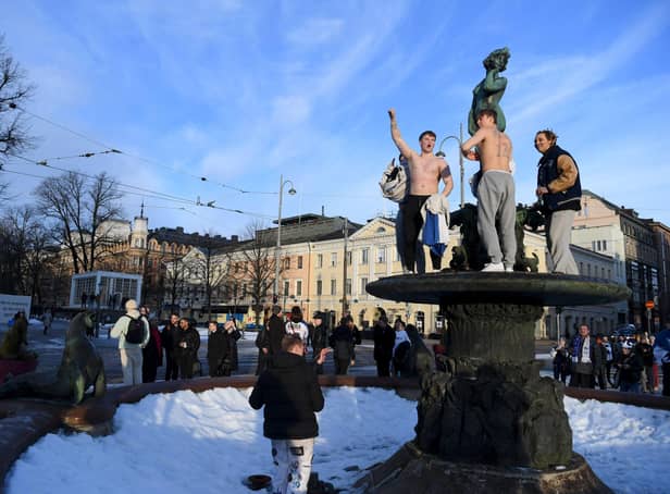 Ice hockey fans celebrate in Helsinki, after Finland's team won the Winter Olympic Games gold medal last year (Picture: Antti Aimo-Koivisto/Lehtikuva/AFP via Getty Images)