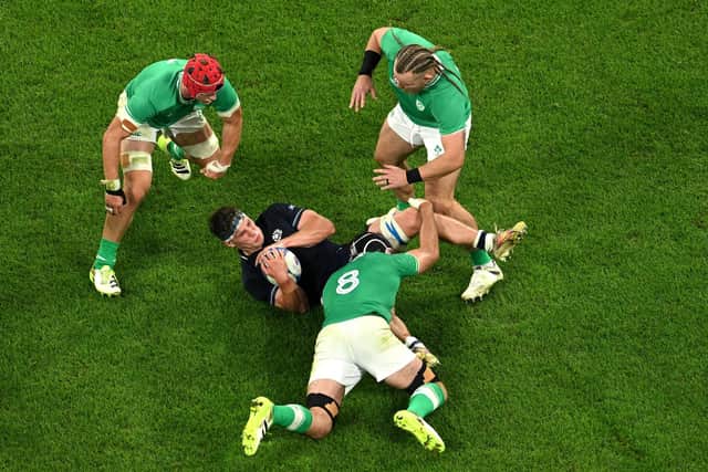 Rory Darge finds himself outnumbered during Scotland's 36-14 defeat by Ireland which ended their Rugby World Cup hopes. (Photo by Matthias Hangst/Getty Images)