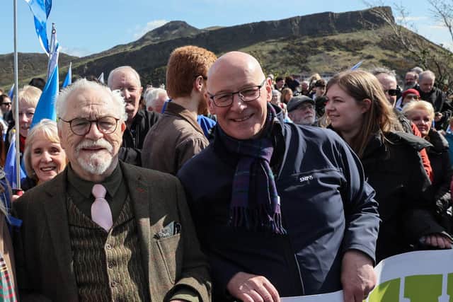 Actor Brian Cox with SNP leader John Swinney as they march in support of Scottish independence in Edinburgh on Saturday (Picture: Robert Perry/AFP via Getty Images)